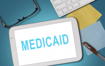 medicaid word on white tablet
