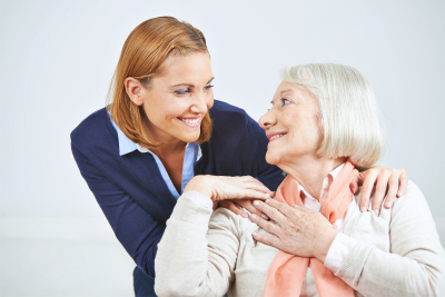 senior woman accompanied by her caregiver