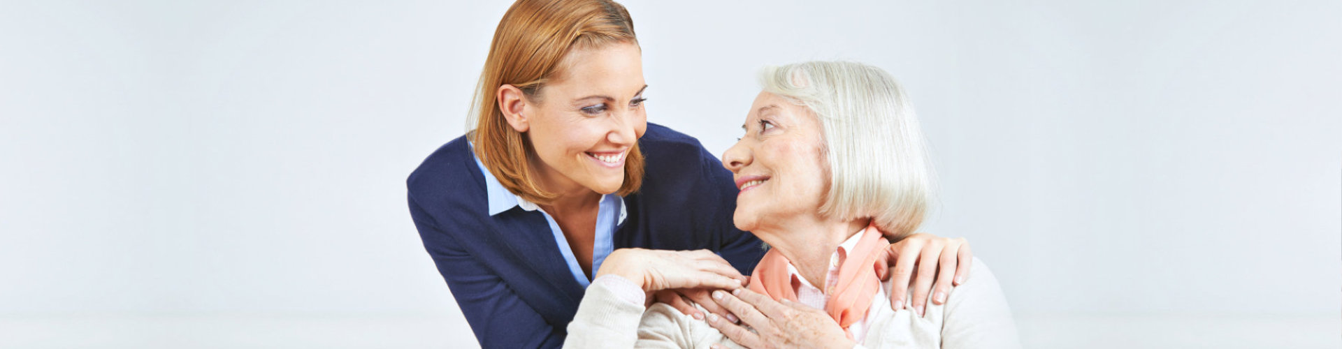 senior woman accompanied by her caregiver